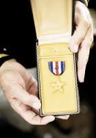<p>
&nbsp;</p>
<p style="margin: 0.0px 0.0px 0.0px 0.0px; font: 9.0px Adobe Caslon Pro">
<span style="font: 8.0px Avenir"><b>Honored and Decorated: </b></span><i>General Vaught displays his Silver Star Medal.</i></p>
<div>
&nbsp;</div>
