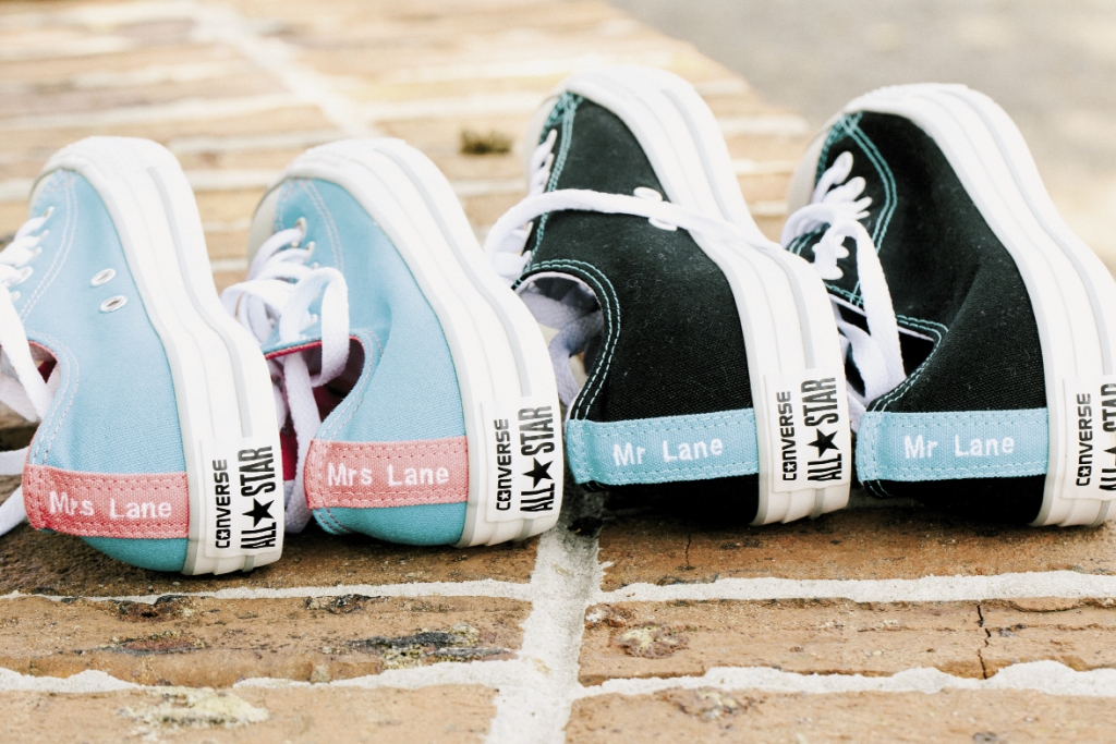 To ensure they could dance the night away without having sore feet, both Kelli and Brandon changed into these customized Converse Chuck Taylor All Star shoes with the words “Mrs. Lane“ and “Mr. Lane.“