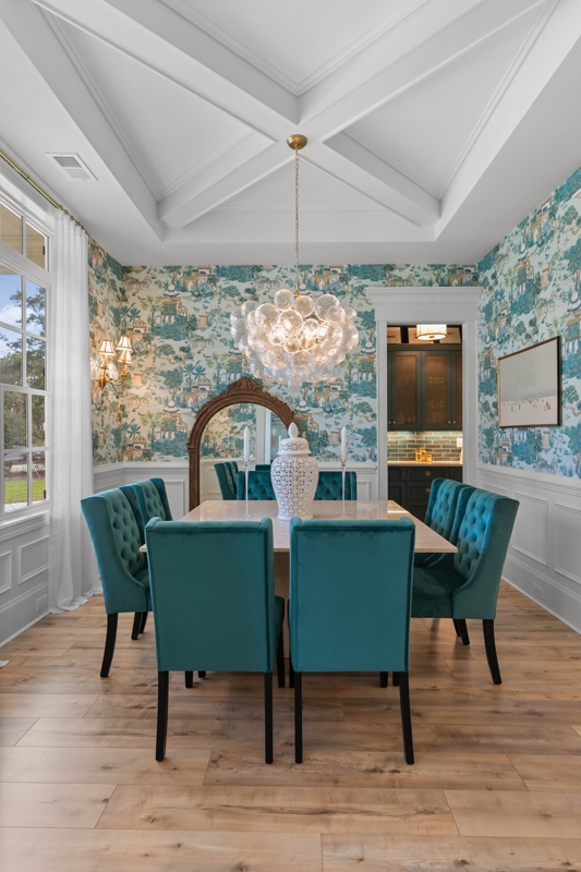 The deep teal dining room provides a dramatic entertaining space.