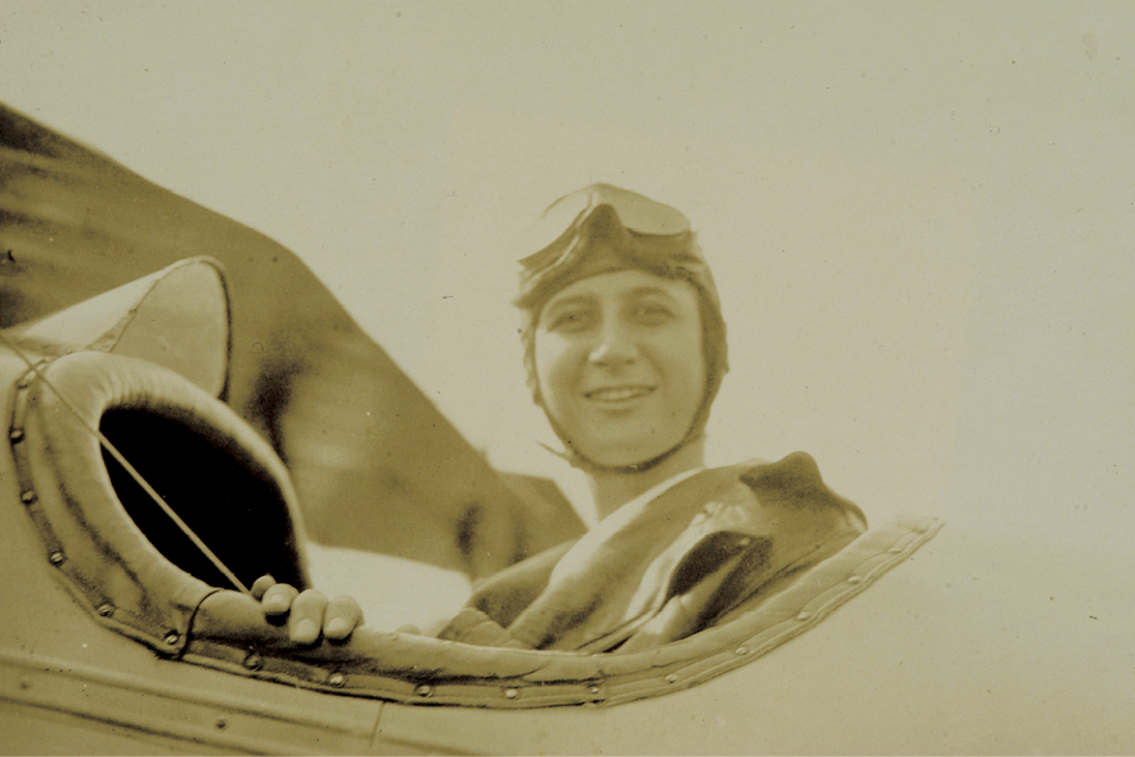 In the cockpit on her first flight with friend and pilot Evangeline Johnson (not pictured) in 1916.