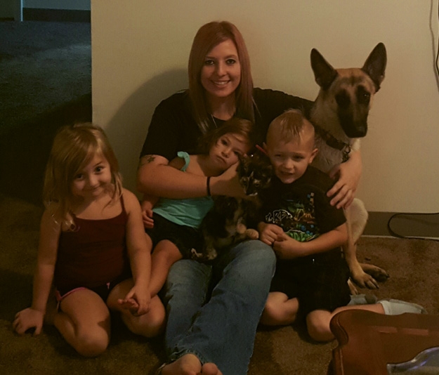 The happy family after being reunited included children Zoie Ann, Scarlett Autumn and Kingston Anthony with mom Amanda Newcomer and Astrid and a new kitten