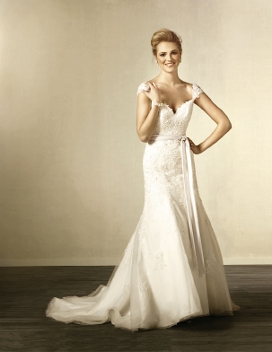Alfred Angelo: With the country chic style in full bloom, this gown looks as though it was pulled from grandmother’s trunk and made super sensuous with the low-cut back and sweep train. Style 2440. Amanda’s Collection, $1,149