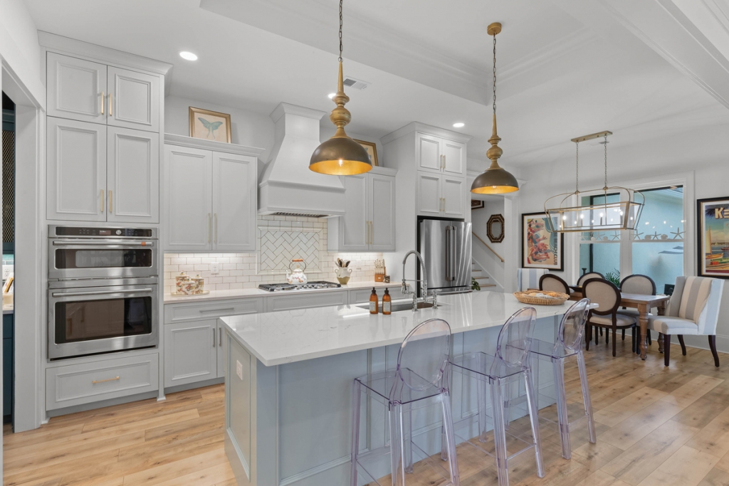 This lovely Pawleys Island French arcadian-inspired home is saturated in shades of teal and steely blues within Malia’s transitional design style of blending contemporary and traditional motifs. It is stunning at every turn, down to the detailed designs of the butler’s pantry