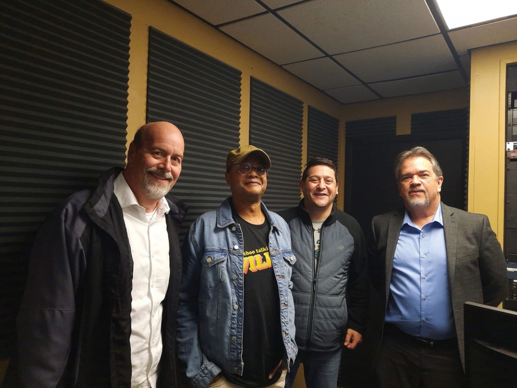Inside the WRNN studio are, from left, Dave Priest, Todd Bridges, Joe Cats, and Casey King.