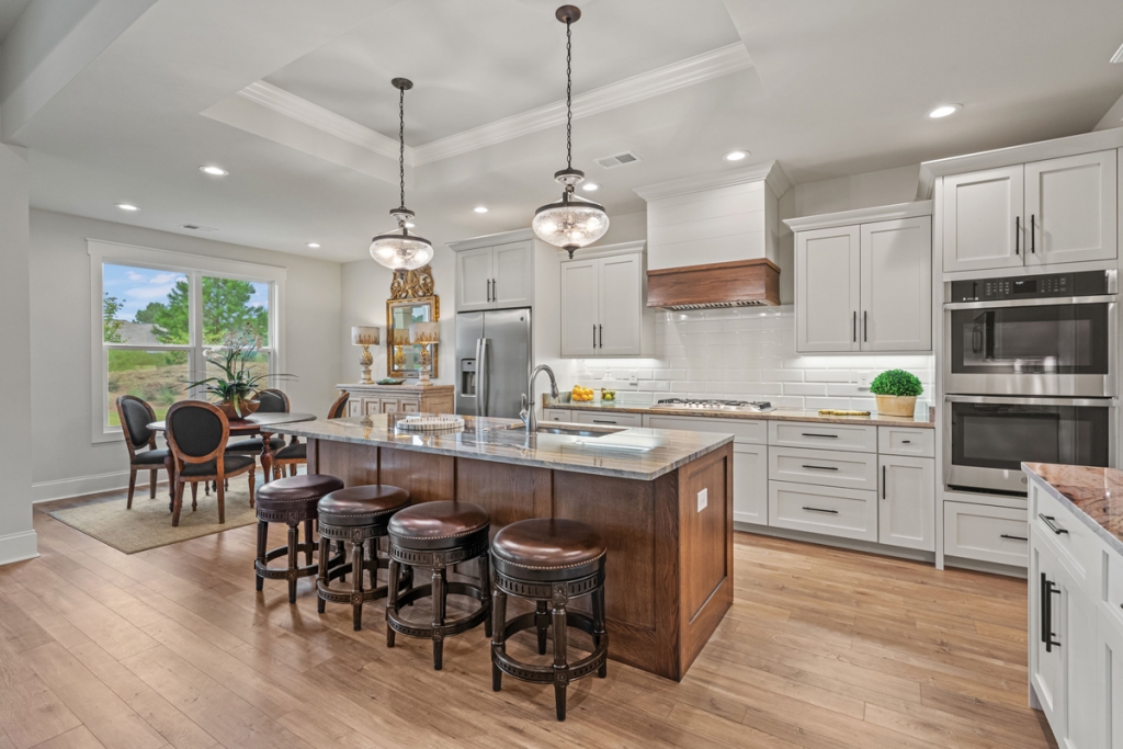 A custom cabinet hood in the kitchen, the Barra model in Thistle Golf Estates elevates everyday living.