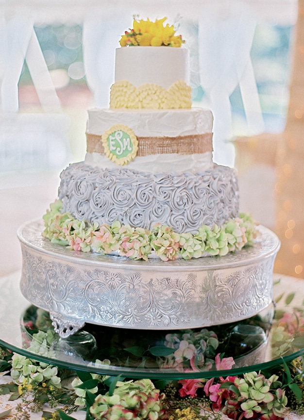 SIMPLE AND ELEGANT: Julie Payne wanted to go with something simple yet unique for her wedding to Jeffrey Morris. Incredible Edibles delivered this three-tier cake with burlap and raffia accents.