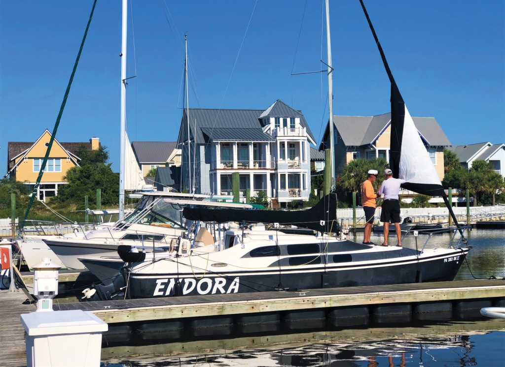 Two of the Maynard brothers make minor repairs to the Endora’s jib while docked at the Bald Head Island marina. The picturesque island requires a golf cart (or bicycle) for any significant exploration.