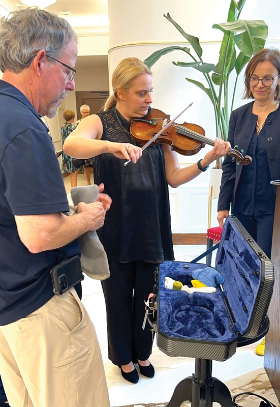 First chair violinist Agata Guzy plays the 200-year-old violin for the first time in some 100 years in the theatre Dean’s great-grandfather built.