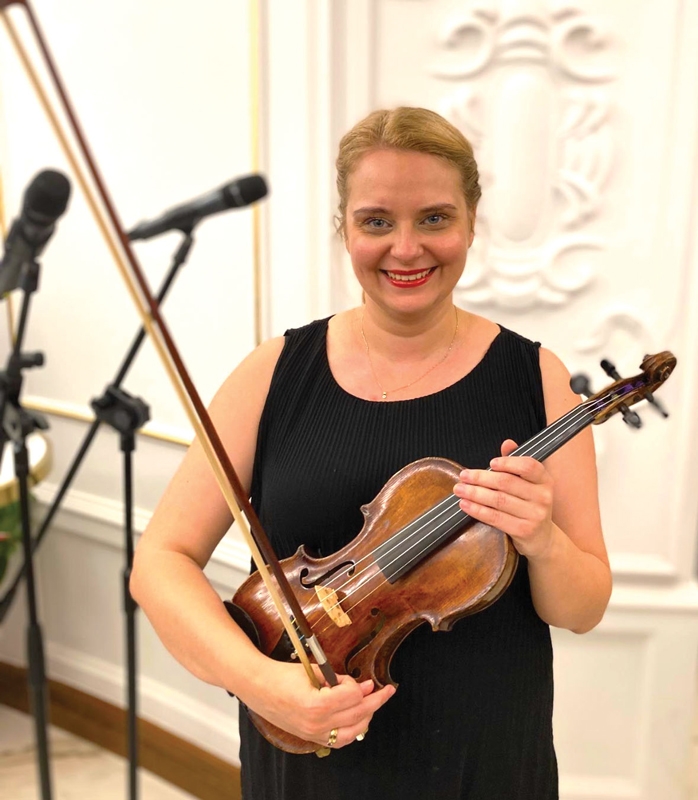 Agata Guzy with the 200-year-old violin.