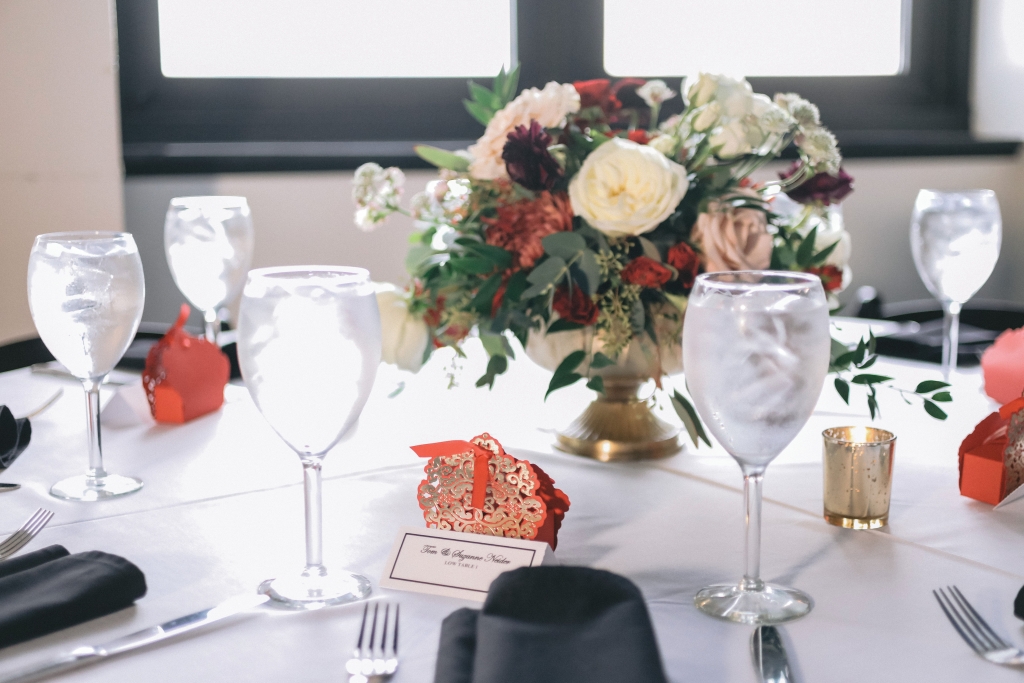 Seasonal Blooms: Christina chose to go with festive florals throughout the wedding bouquets and centerpieces.