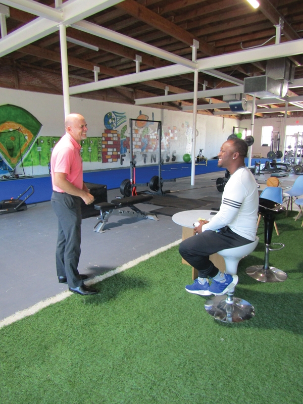 Butler laughs with  Myrtle Beach Downtown Alliance CEO Jason Greene during a recent visit.