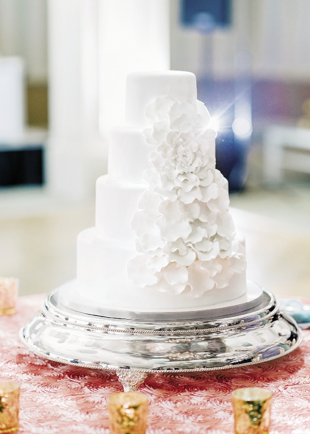 VELVET STUNNER: Each rose petal was individually placed to create a beautiful large rose on this Incredible Edibles cake for Alexis Gentle and Scott Dominick. The cake flavor was sour cream red velvet and the layers were ombre style from deep rich red velvet to soft pink red velvet.