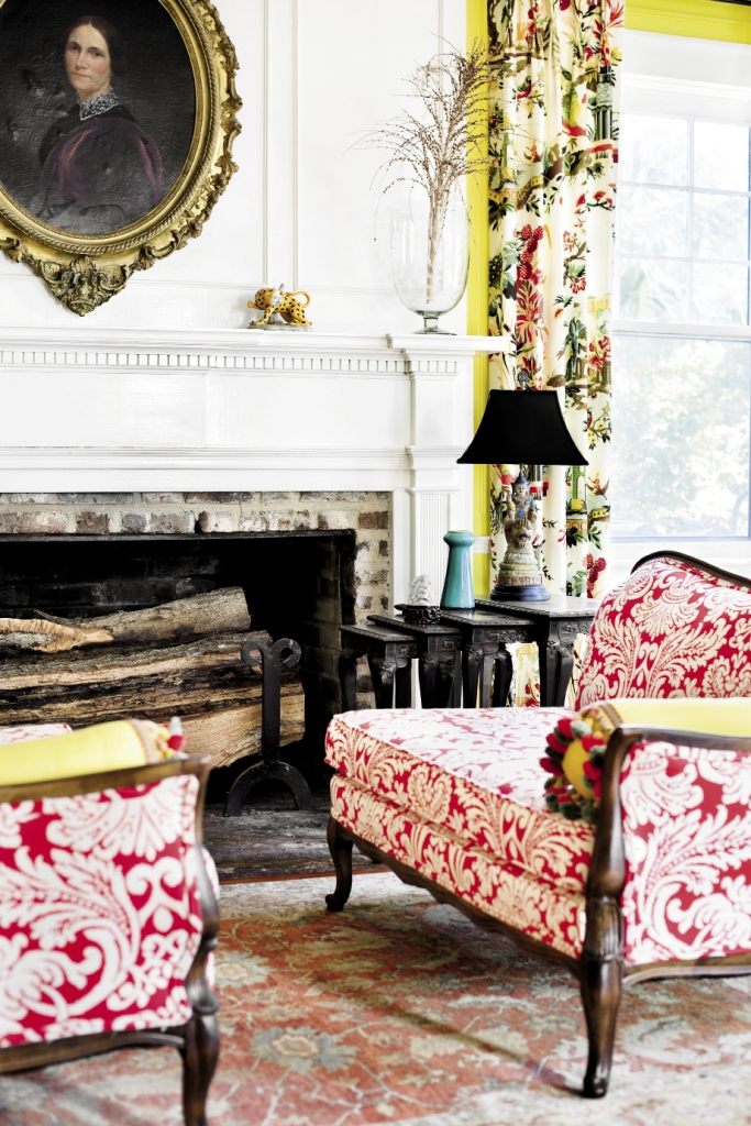 The entry and main room at Estherville Plantation is decorated in bold Colonial colors and striking fabrics