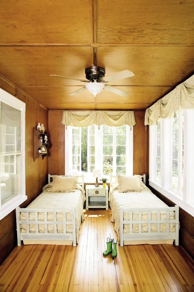 The original sleeping porch has been perfectly restored to become a charming guest room for sleep-overs
