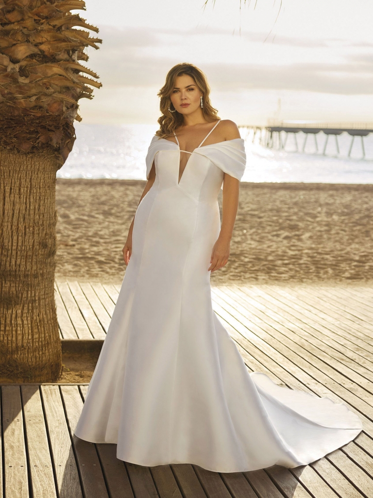 White One Cher by White One, this stunning Mikado fit and flare gown features unique architectural details. Two Oaks Bridal Boutique, call for price