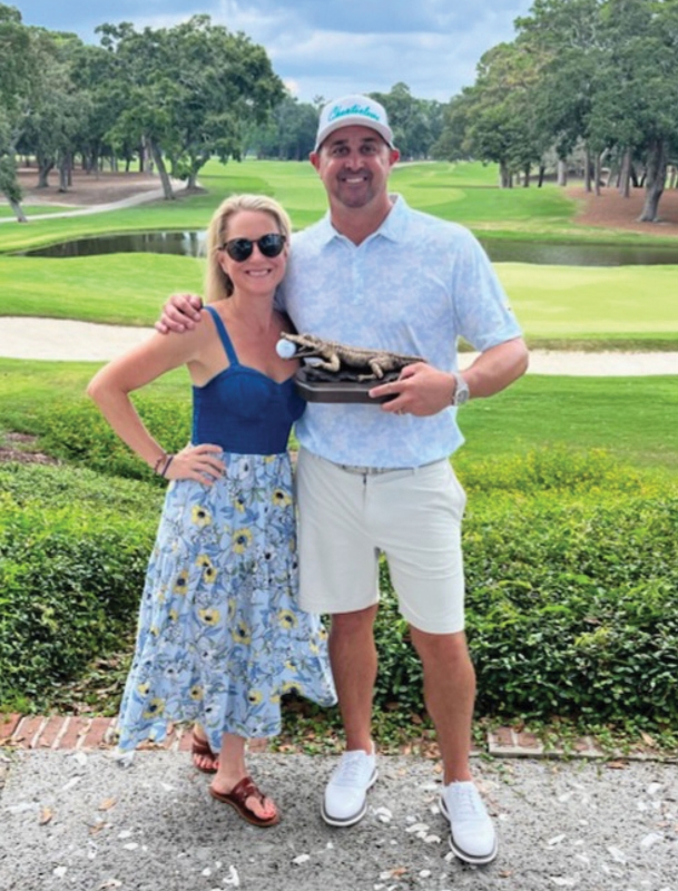 CCU Head Coach Wilner and his wife Amanda pose with The Dunes 2023 Men’s Club Championship trophy he earned with a 7 stroke victory.