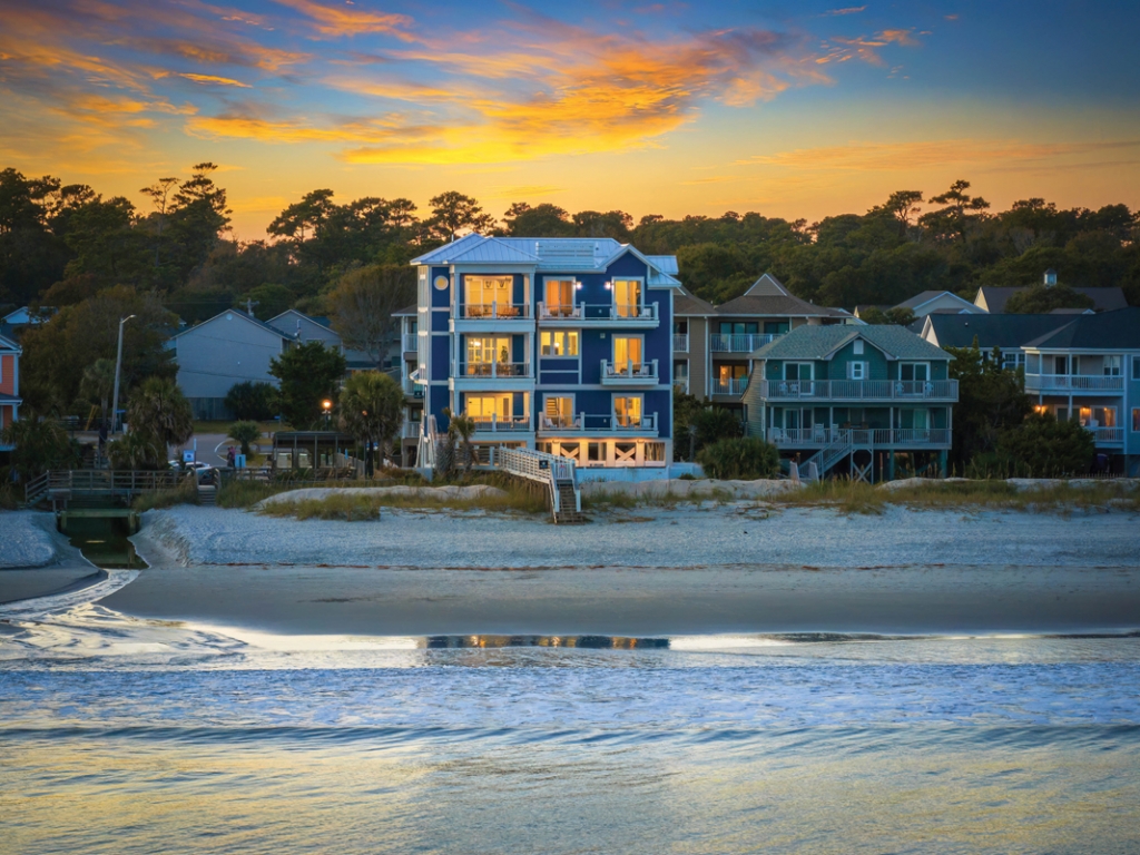 219 S Seaside Drive, Surfside Beach Home of Andrew Entwistle - The primary suite  and five other bedrooms feature private oceanfront balconies.