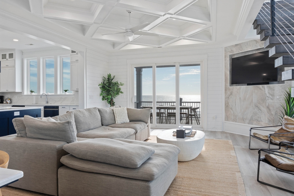 The eight-bedroom, eight-bath customized oceanfront home features luxe, modern design elements at every turn.