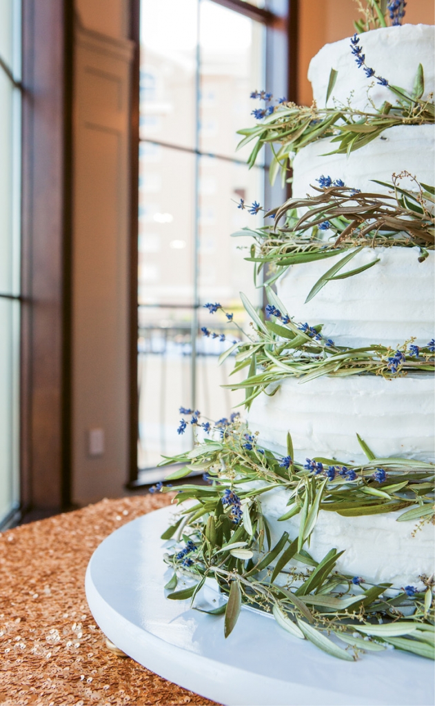 Stunning Details: Gorgeous Greek icons were woven into the Greek olive wreaths that wrapped the tiered cake