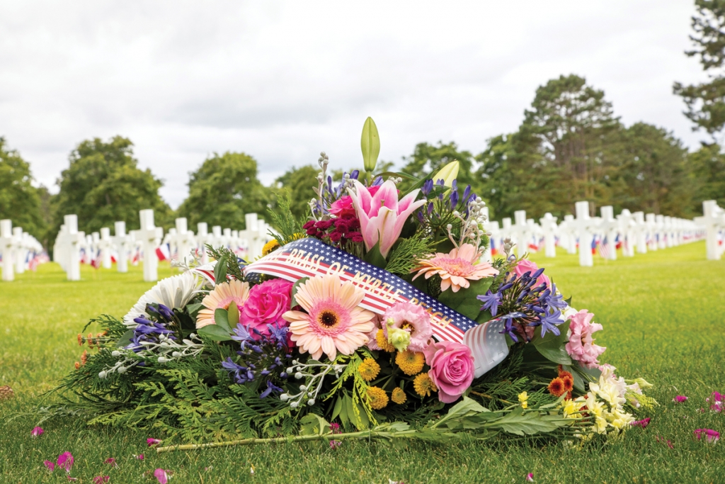 Band members placed a memorial wreath at the American Cemetery on the bluff above Omaha Beach in Normandy.