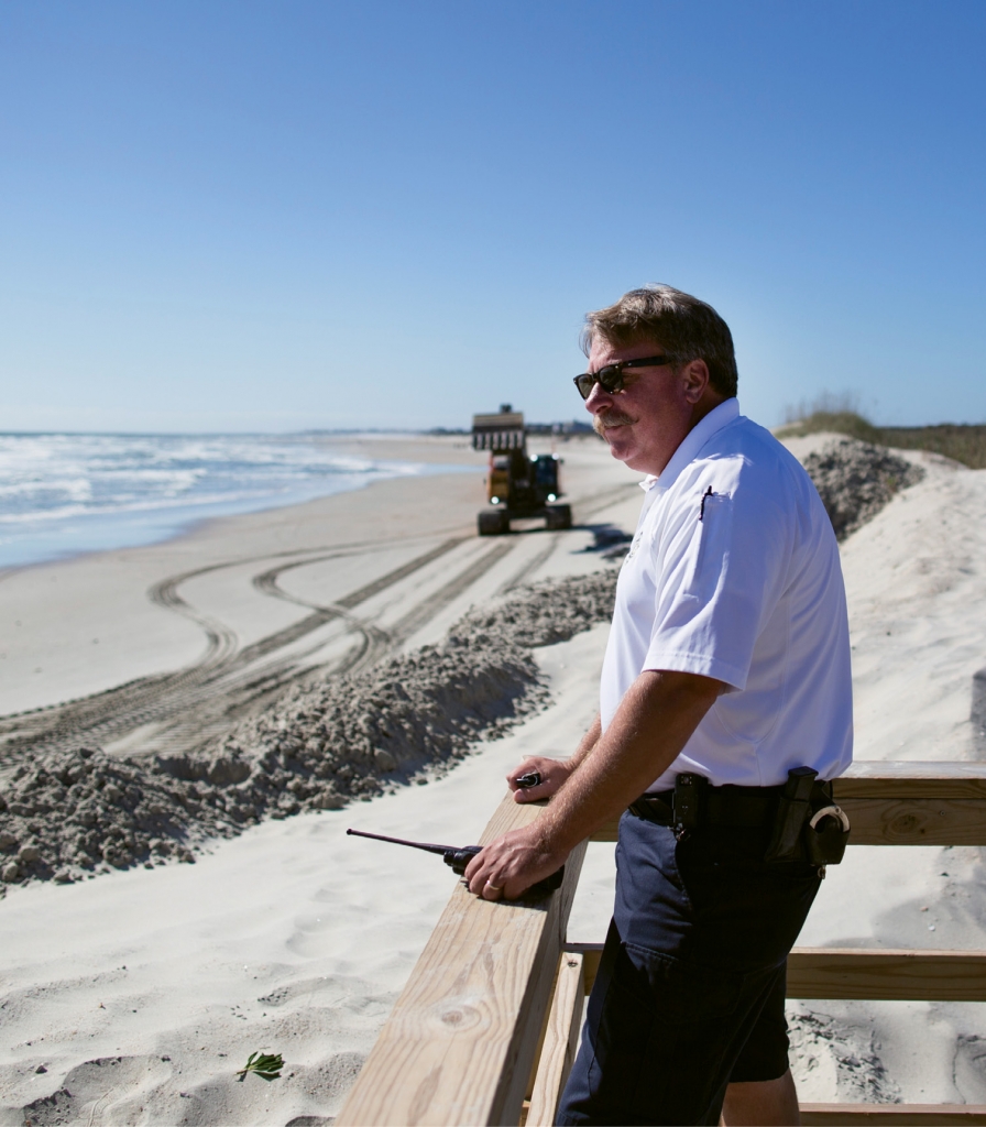 Mike Fanning checks in on beach reclamation efforts as part of his daily rounds as Chief of Police at Pawleys Island.