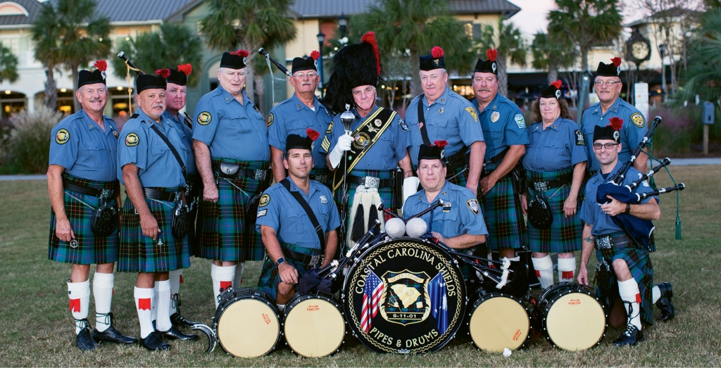 The Coastal Carolina Shields Pipe and Drum Band make a stunning presence in their finest dress uniforms.