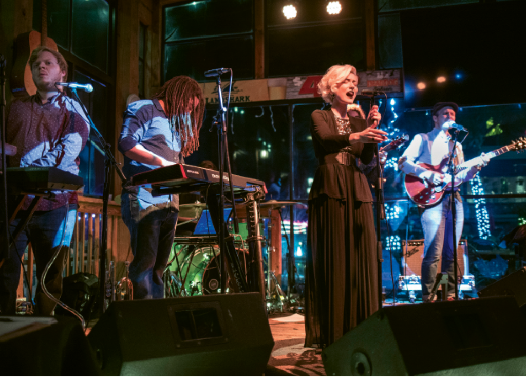Liz Kelley-Tavernier, (center) vocalist for Oracle Blue, performs with the band at the Dead Dog Saloon in Murrells Inlet.