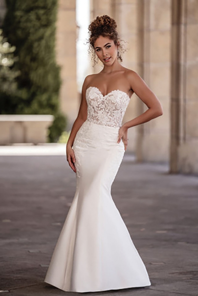 Allure Bridals Form-fitting stretch Mikado composes the fit and flare skirt of this strapless gown by Allure Bridals. Fancy Frocks, $2,175