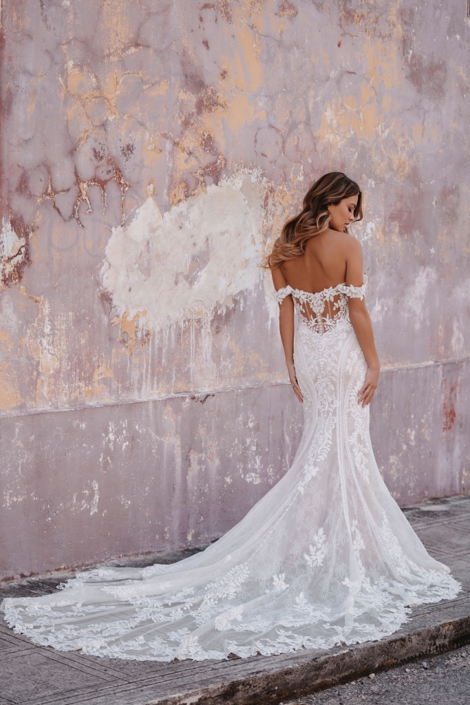 Allure Bridals - All the lush floral lace imaginable adorns the striking lines of this off-shoulder sheath gown, style 9962. Fancy Frocks, $2,473