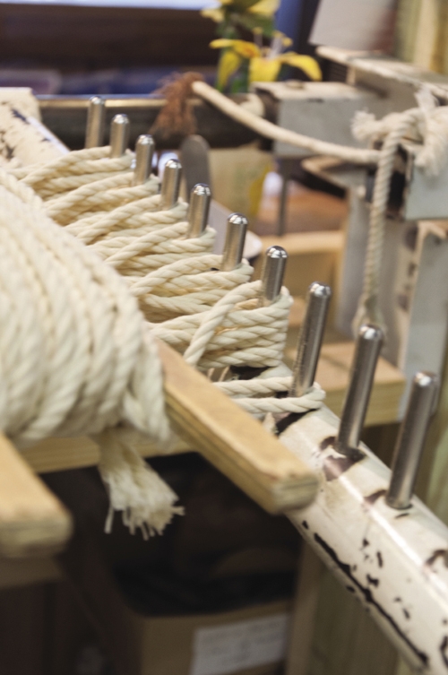 The rack helps Marvin Grant weave the top part of the hammock that holds it all together.