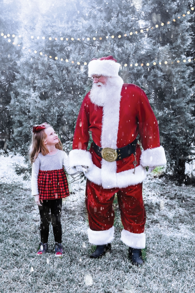 Santa Harry with granddaughter at Booth’s Christmas Tree Farm in Conway.