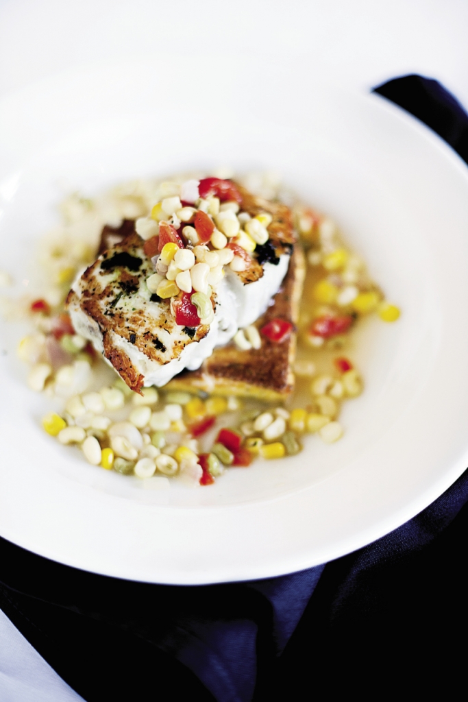 Pretty Tasty: Hog snapper may be an ugly fish, but once it’s pan seared, placed on a grit cake and covered with succotash, it looks irresistible.