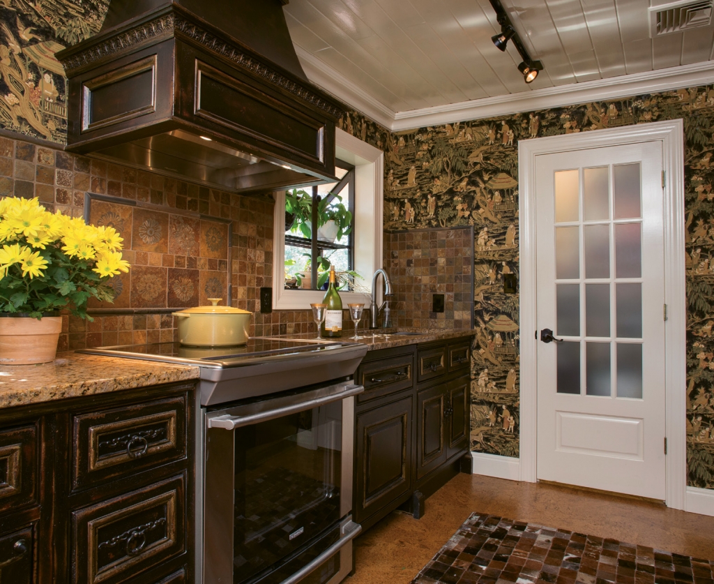 The kitchen is decked out with Habersham cabinetry, new cork flooring and a fetching animal hide patchwork rug.