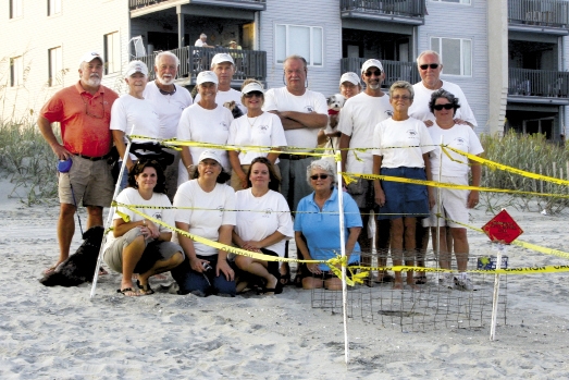 The North Myrtle Beach Sea Turtle Patrol, pictured here in 2010, stands in front of one of the newly discovered nests.