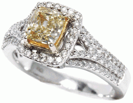 YELLOW FEVER: Color your world with this stunning 14k white gold ring. It features a 1 carat cushion-cut natural canary yellow diamond in the center, which is surrounded by sparkling round diamonds. (1.5  total cts.) Reeds, $7,500