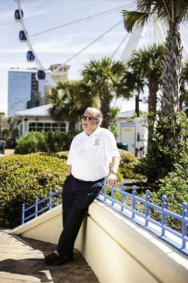 Leading the Way: Myrtle Beach Mayor John Rhodes beams in the abundant sunshine at Plyler Park, adjacent to the SkyWheel, which is just one of a half-dozen attractions and improvements to the city completed during his tenure.