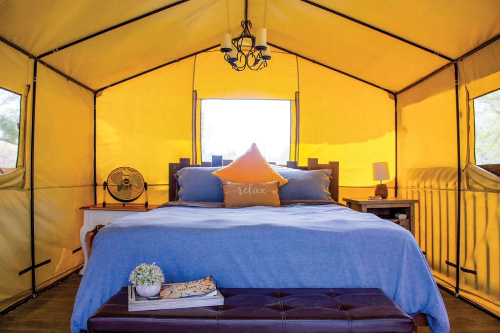 Stay at a glam designed tent, and kayak on the river at RIA.