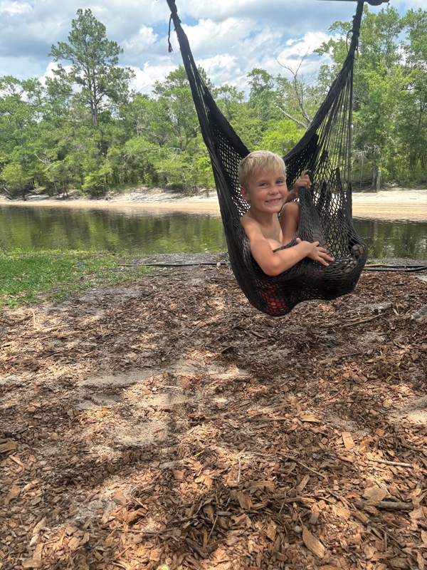 My son, Xander, cuddles up in one of the many hammocks on the island.