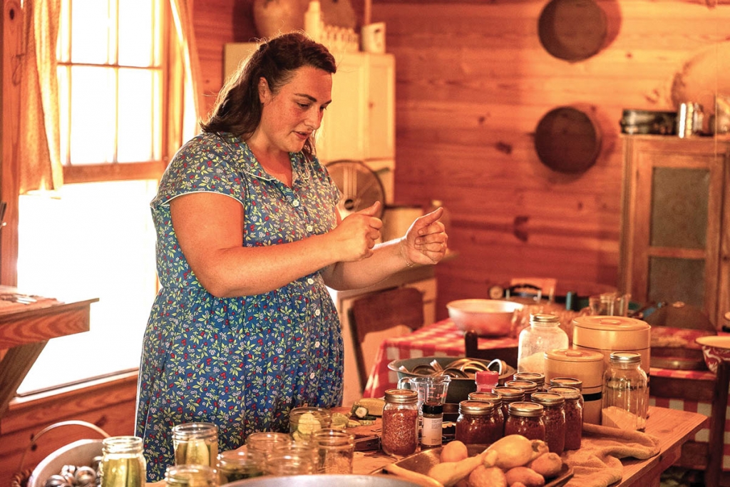 12:29pm: Assistant Museum Director Marian Calder demonstrates canning, the best way to preserve fruits and vegetables for use when the crops are out of season. The L.W. Paul Living History Farm demonstrates tasks which were once commonplace for many Americans.