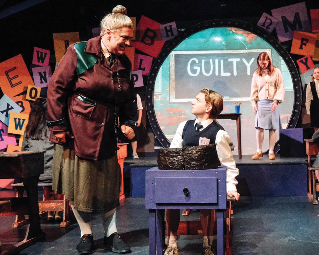 Greg London as Miss Trunchbull with Harrison Garrett and Annabel Poinsette in &quot;Matilda the Musical&quot; | credit: Scott Dean