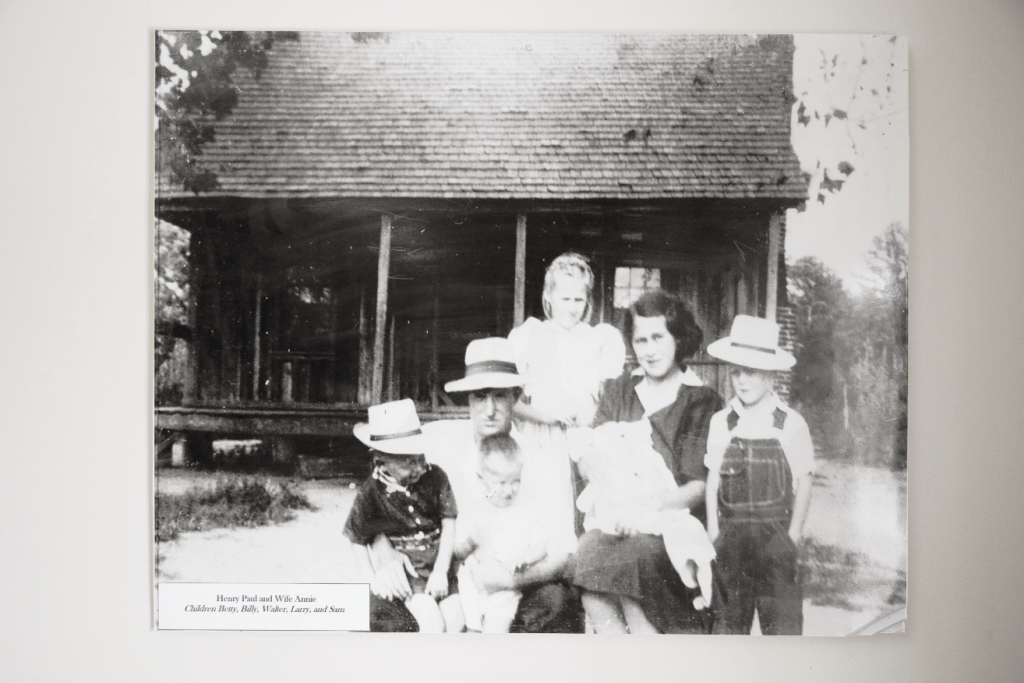 The Paul family in front of the family farmhouse, a replica of which may be found at the L.W. Paul Living History Farm.