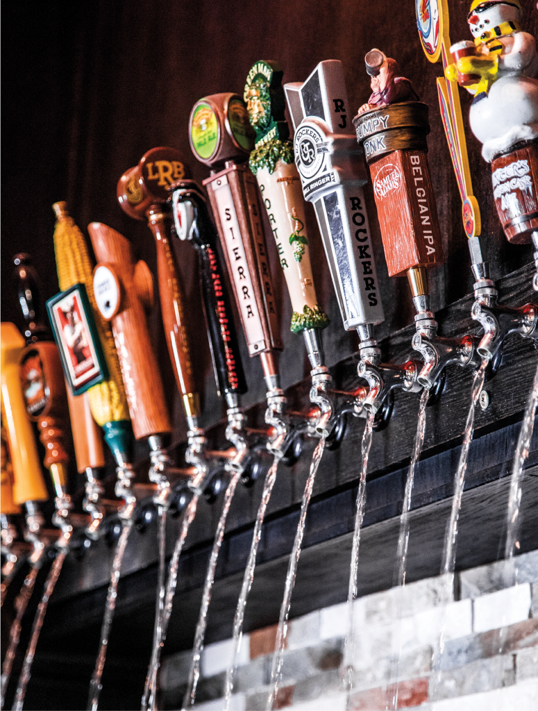 The Grumpy Monk&#039;s entrance features a 20-tap faux beer waterfall.