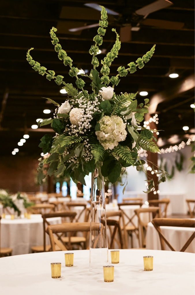 Different green tones where showcased, along with white florals. The flowers were purchased from Costco Wholesale and arranged by Amanda Patrick.