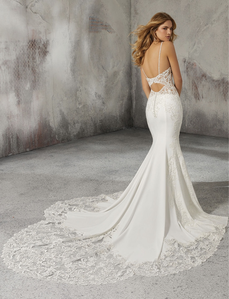 MORILEE LIZZIE - This stunning V-neck, spaghetti strap bridal gown features extraordinary beading, embroidery, and appliquès on an intricately designed crepe sheath wedding dress. MJ Bridal Collection; Prices available on request