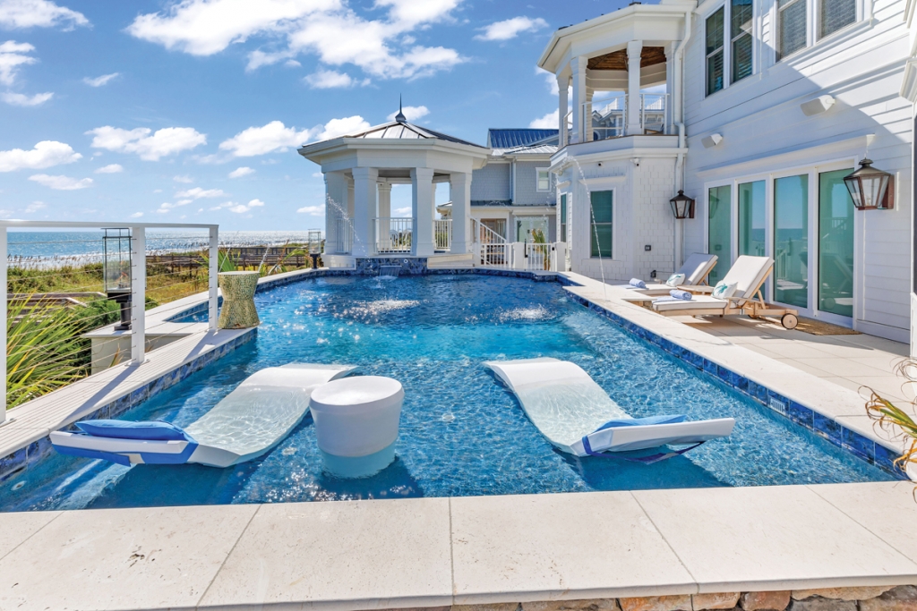 The Watts’ oceanfront home at 8918 North Ocean Blvd., Myrtle Beach, boasts nearly 2,500 square feet of deck areas, including an ocean view pool, hot tub, and tanning shelf on the main level deck surrounded by gas torches