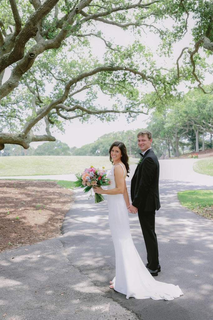 Near and Far:  Olivia and Jay&#039;s happily ever after began down the aisle oceanside, embraced by the warm colors and love from friends and family.