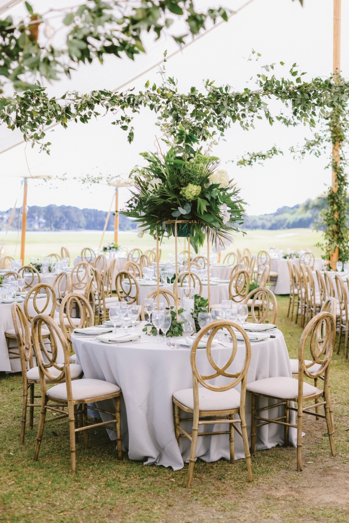 Breathtaking Beauty: Bride and groom accented the natural setting with a plethora of white and green florals.