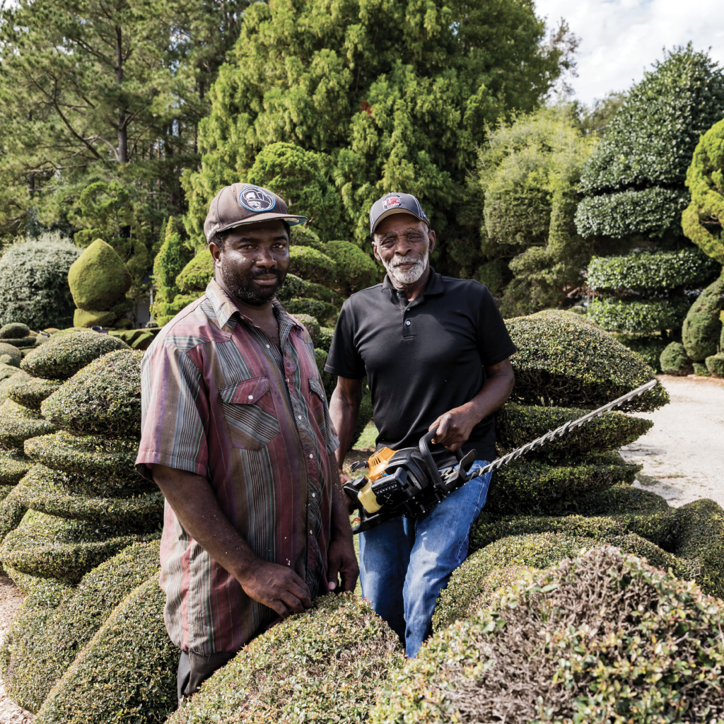 Helping Hand: “One thing about life: no matter who you are, one day Old Man Time will slow you down,” says Fryar, who will turn 80 in December. He’s pictured here with his longtime assistant, Michael Baker.