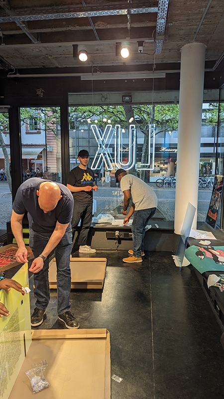 CCU’s Professor of Graphic Design, Scott Mann, works with students to install exhibit for annual International Days 2023 event in Mainz, Germany.