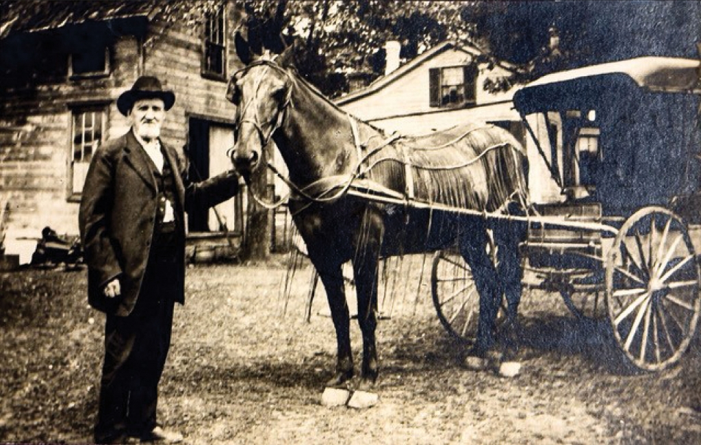 Philetus Doolittle poses with his horse-drawn wagon. Philetus was a horse-drawn ambulance driver in the Civil War.